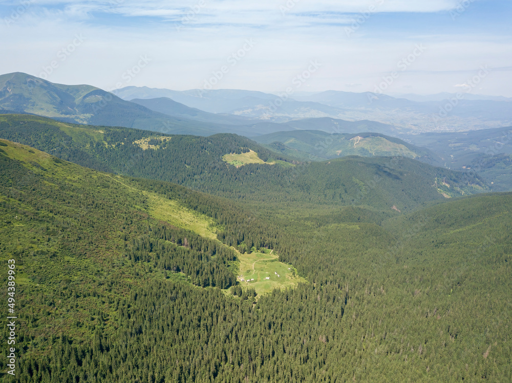 Naklejka premium High mountains of the Ukrainian Carpathians in cloudy weather. Aerial drone view.