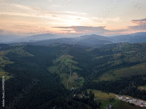 Sunset over the mountains in the Ukrainian Carpathians. Evening. Aerial drone view.