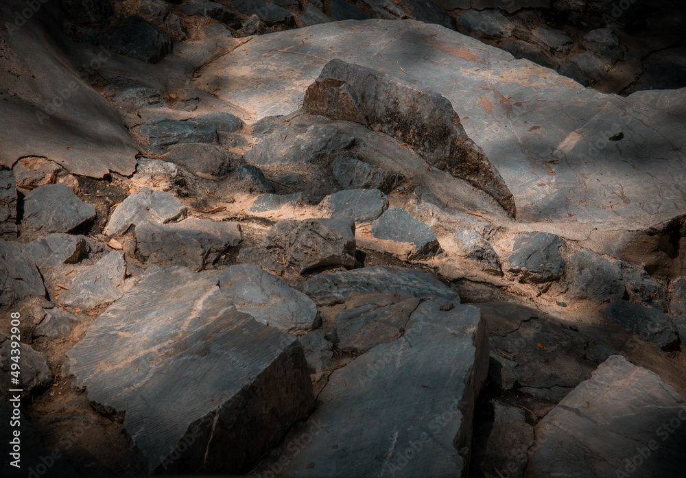 Sunbeams lighting down of stone slab at brookside. Abstract background texture, Beautiful background for wallpaper, Copy space, No focus, specifically. Sunbeams lighting down of stone slab at brookside. Abstract background texture, Beautiful background for wallpaper, Copy space, No focus, specifically.
