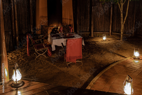 Bush dinner table with lanterns, ,South Africa Kwazulu natal, luxury safari lodge in the bush of a Game reserve photo