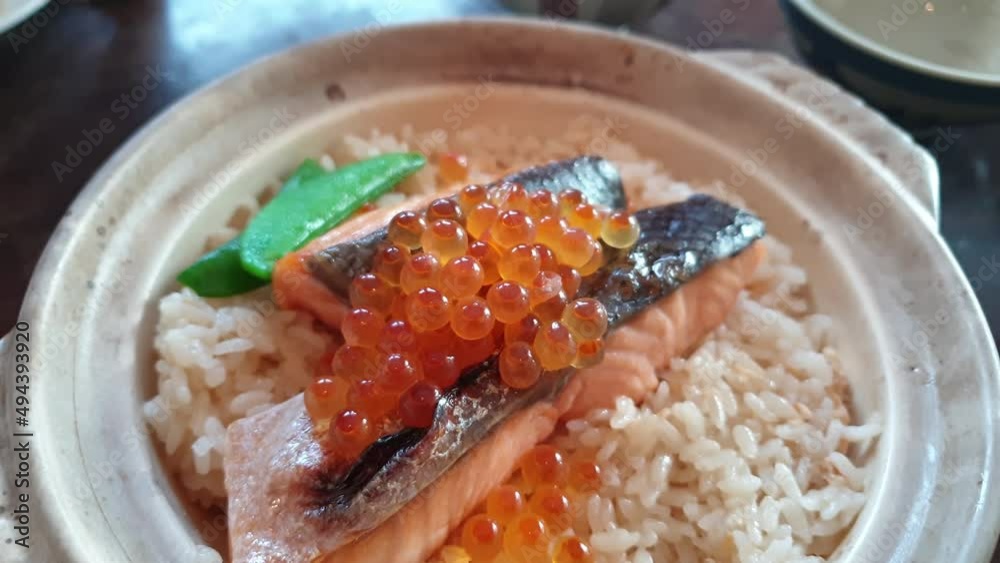 baked Japanese food grilled salmon rice don in claypot toppin gwith ikura roe