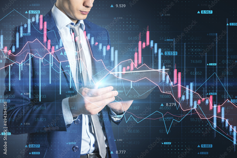 Businessman hand using tablet with abstract downward forex chart on blurry dark background. Crisis, finance and collapse concept. Double exposure. Businessman hand using tablet with abstract downward forex chart on blurry dark background. Crisis, finance and collapse concept. Double exposure.