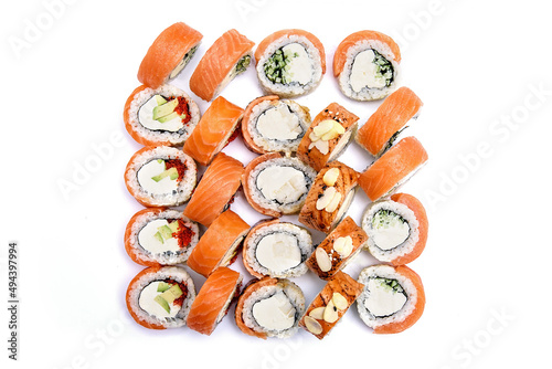 Sushi set with philadelphia cheese, salmon, avocado and almond flakes on a white background