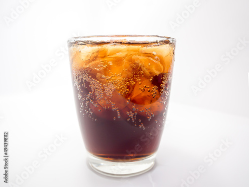 glass of cola with ice and with background, copy sapce