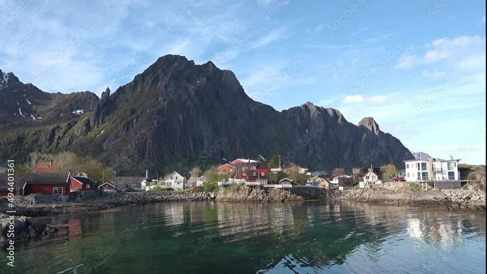 Small fishing village of Hamnoya on Lofoten islands in Norway, popular tourist destination with its typical red houses and natural beauty. Red houses in Norway on the Lofoten Islands. Small fishing village of Hamnoya on Lofoten islands in Norway, popular tourist destination with its typical red houses and natural beauty. Red houses in Norway on the Lofoten Islands.
