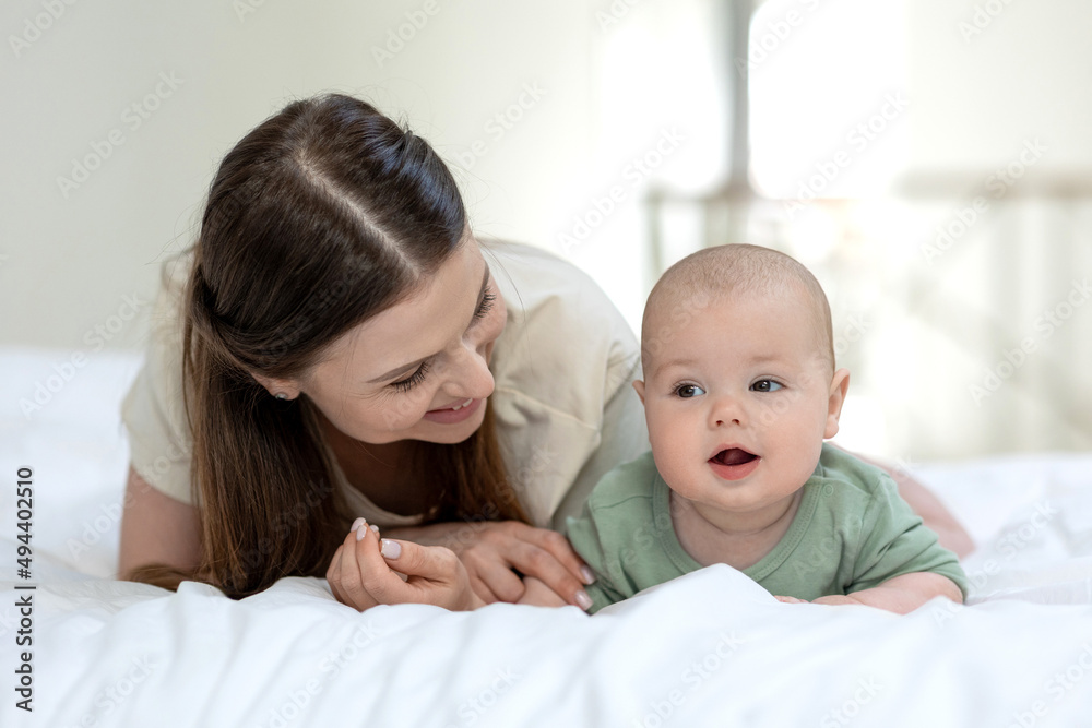 Mom and baby. Beautiful woman with a baby at home. High quality photo Mom and baby. Beautiful woman with a baby at home. High quality photo