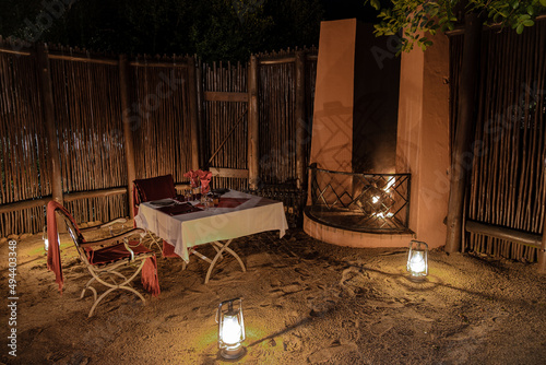 Bush dinner table with lanterns, ,South Africa Kwazulu natal, luxury safari lodge in the bush of a Game reserve photo