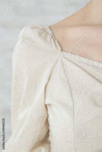 Wallpaper Mural Female model wearing retro linen blouse. Natural dyed organic linen clothing. Studio shot.  Torontodigital.ca