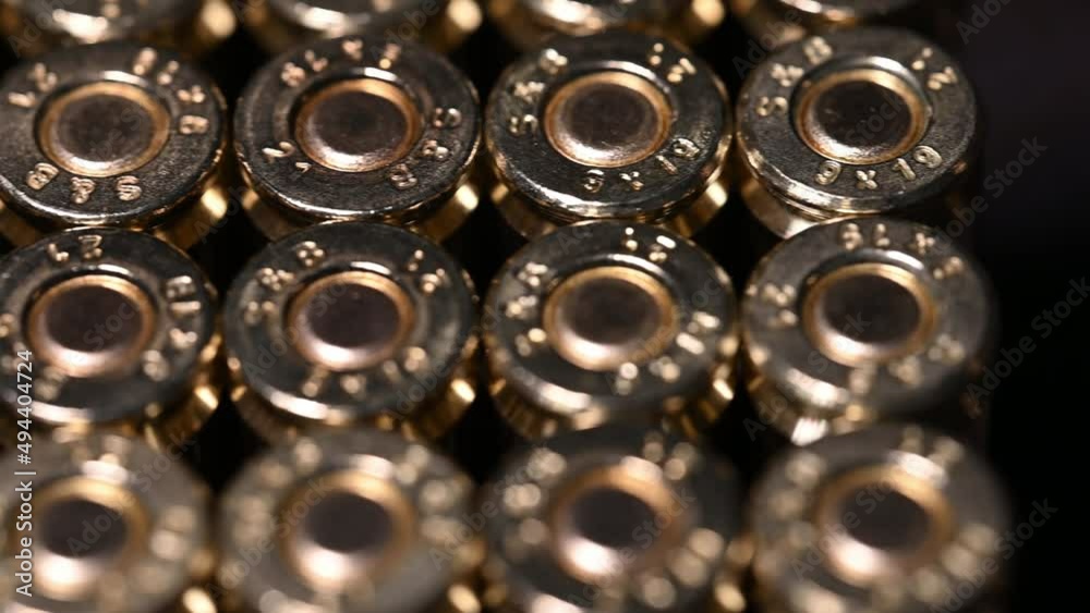 slow slide over the back of 9mm ammunition and shell primer slow slide over the back of 9mm ammunition and shell primer