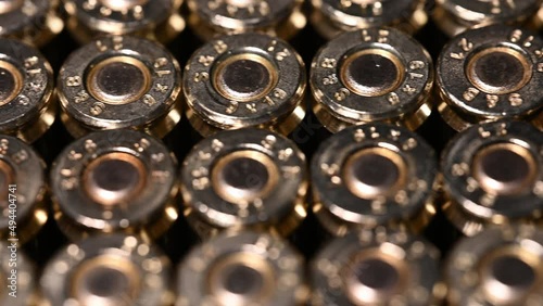 macro left to right slide over shiny new 9mm bullets photo