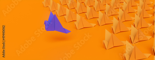Origami Birds against a Orange background. Manager concept with Copy Space. photo