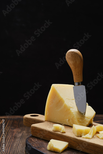 Parmesan cheese on wooden cutting board