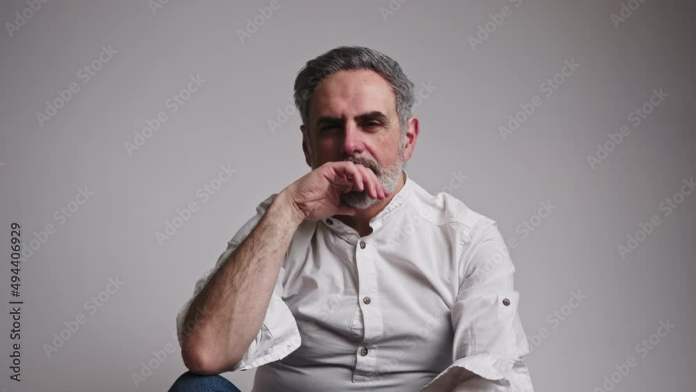50s year old man looking up and then having a thoughtful pose full of thoughts. High quality 4k footage 50s year old man looking up and then having a thoughtful pose full of thoughts. High quality 4k footage