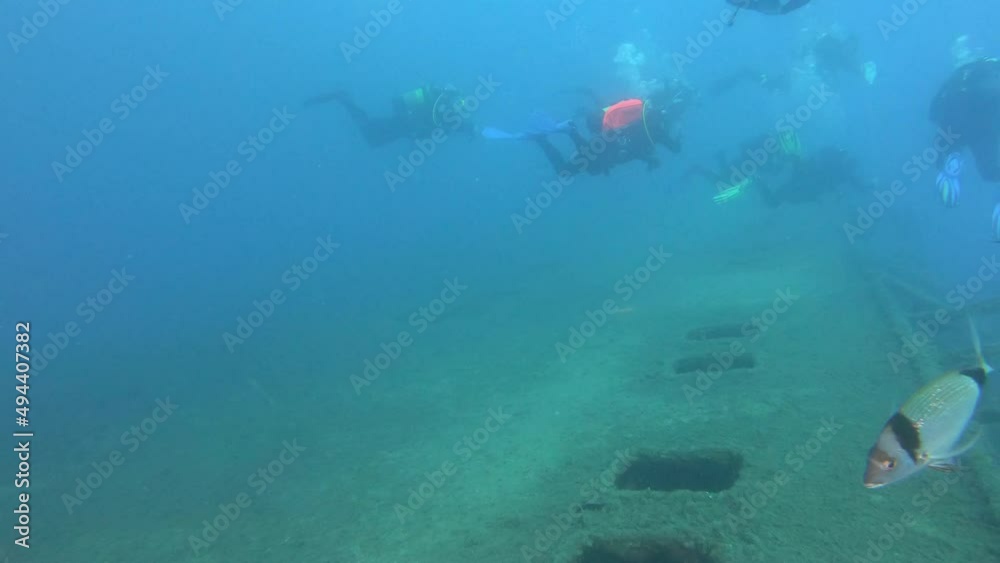 Scuba divers swims on the Shipwreck Swedish ferry MS Zenobia. Wreck diving. Mediterranean sea, Cyprus. Maritime disasters. Underwater 4K video filming Shot Of Sunken Ship. World tragedies under water Scuba divers swims on the Shipwreck Swedish ferry MS Zenobia. Wreck diving. Mediterranean sea, Cyprus. Maritime disasters. Underwater 4K video filming Shot Of Sunken Ship. World tragedies under water