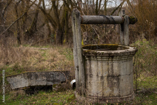 An old well at the farm. Well for drawing water located in the countryside.