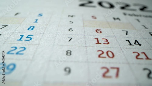 Janyary and February of New Year. 2022. Macro shot of many holidays and business dates in New Year. Cristmas, Valentine's day. February 14. Vacation concept. Dtailed dates calendar 2022