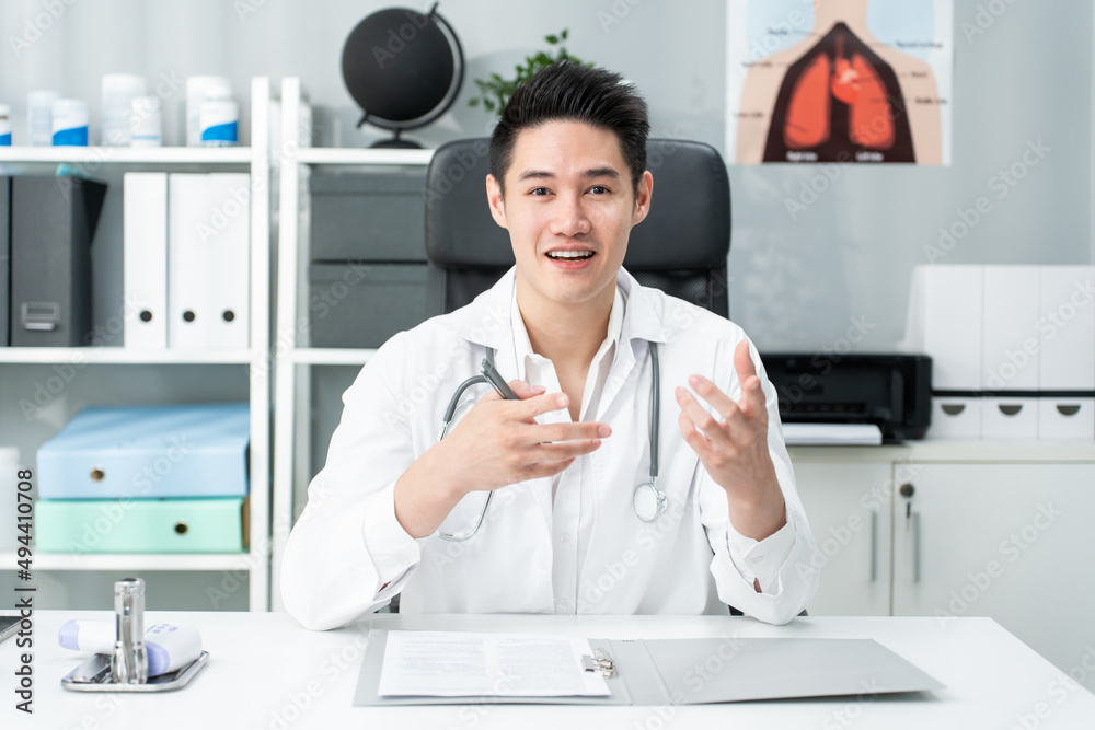 Asian male medical doctor talking virtual online with patient at home. Asian male medical doctor talking virtual online with patient at home.