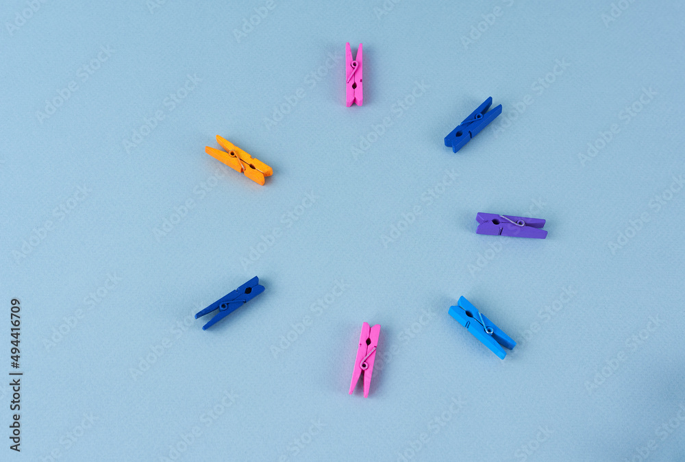 multicolored clothespins on a blue background, copy space, close-up
multicolored clothespins on a blue background, copy space, close-up