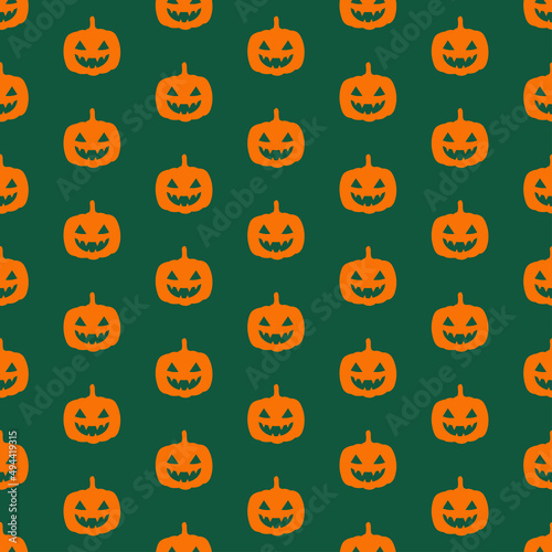 Green seamless pattern with halloween scary pumpkin.