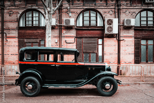 Old taxi waiting at a train station. Vintage car. Oldtimer