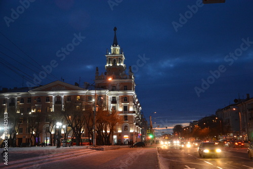 Residential building with a tower in the evening light in the city of Komsomolsk-on-Amur