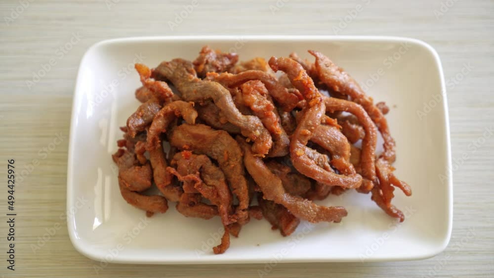 Sun-Dried Pork on white plate - Asian food style Sun-Dried Pork on white plate - Asian food style