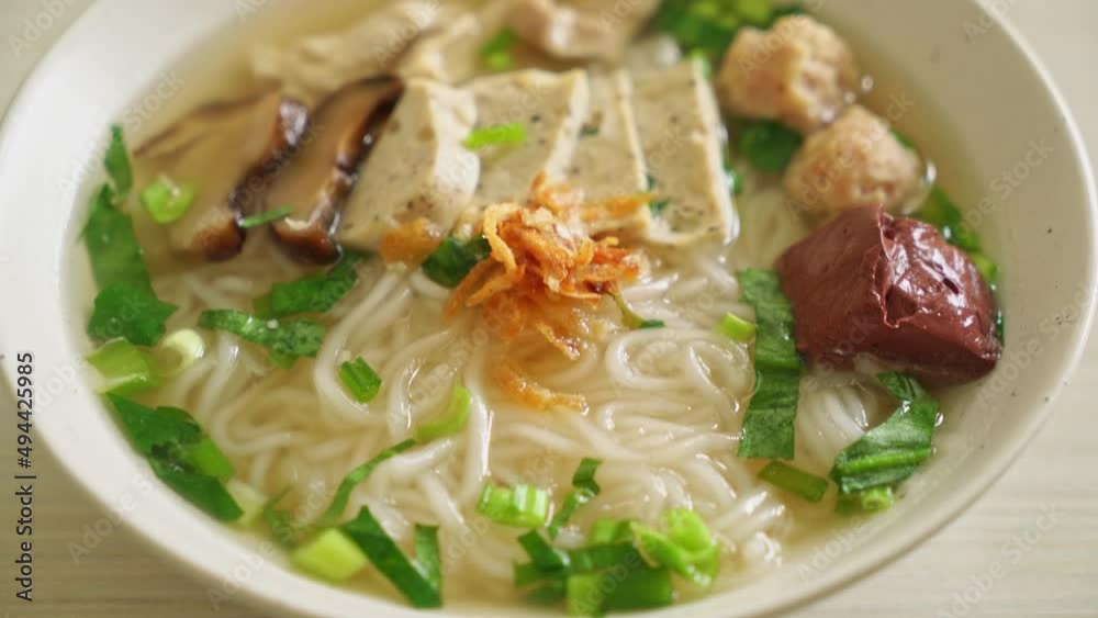 Vietnamese Rice Noodles Soup with Vietnamese Sausage served vegetables and crispy onion - Asian food style Vietnamese Rice Noodles Soup with Vietnamese Sausage served vegetables and crispy onion - Asian food style