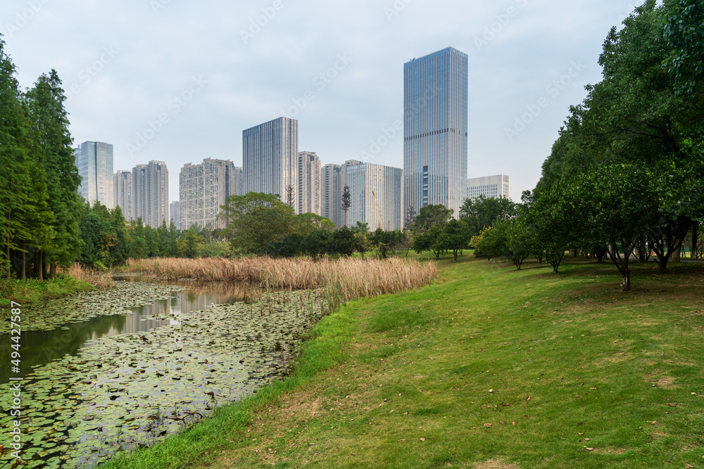 Obraz premium spring park and modern city