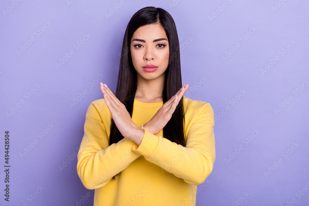 Photo of young pretty girl show arms enough forbidden avoid symbol isolated over purple color background Photo of young pretty girl show arms enough forbidden avoid symbol isolated over purple color background