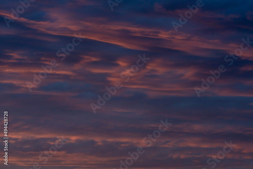 Fototapeta Naklejka Na Ścianę i Meble -  Colorful clouds in the rays of the setting sun