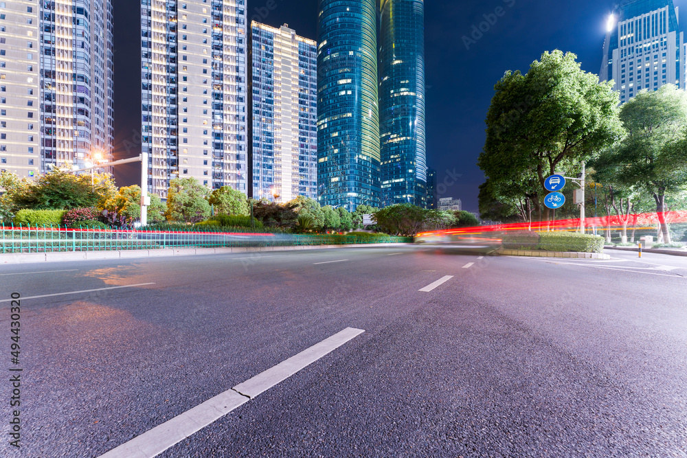 the light trails on the modern building background in shanghai china.