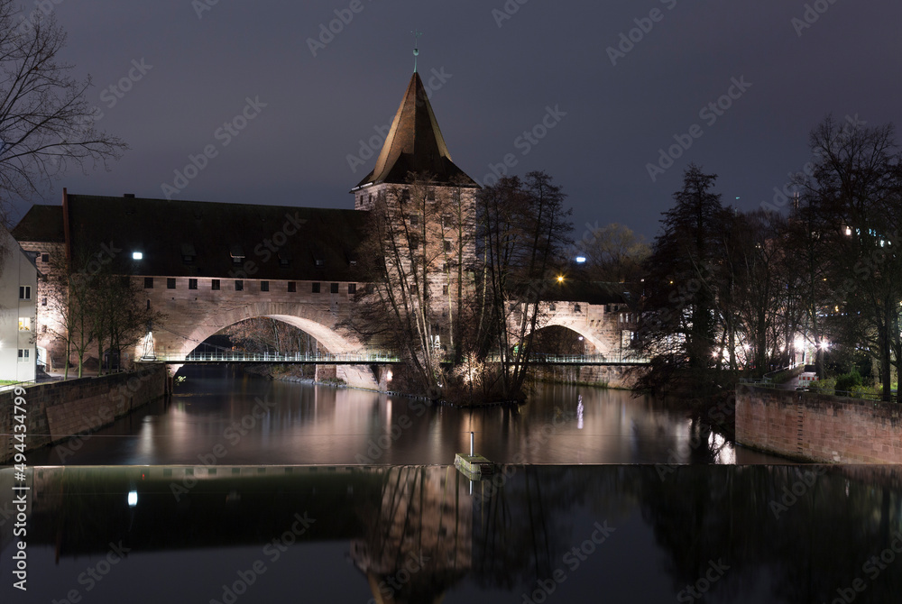 Nuremberg. Bridge over the Pegnitz River and Water tower in night, German