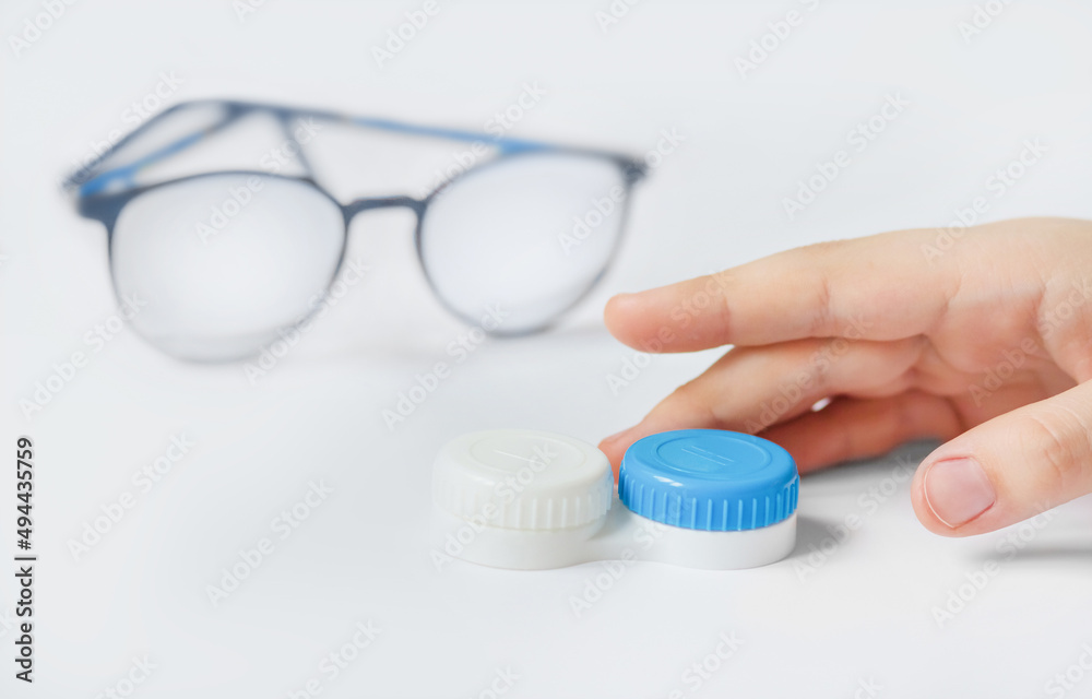 The child's hand reaches for the lenses, not the glasses. The counterweight of lenses to glasses. The child's hand reaches for the lenses, not the glasses. The counterweight of lenses to glasses.