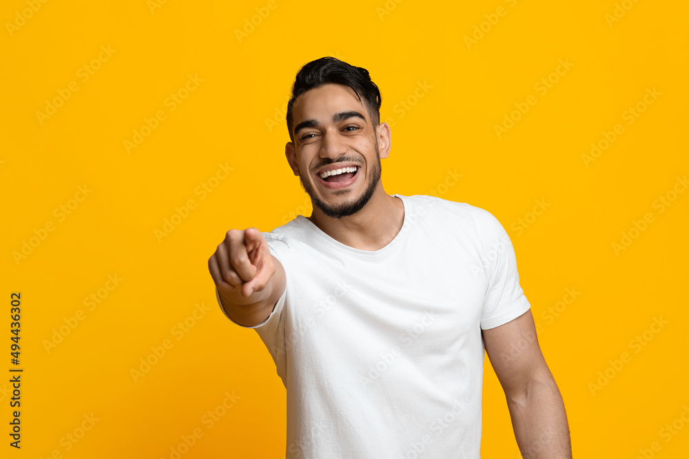 Laughing middle eastern guy pointing at camera Laughing middle eastern guy pointing at camera