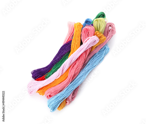 Colorful embroidery floss set on white background, top view