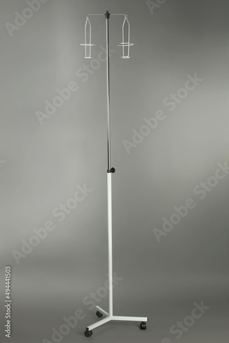 Drop counter stand on grey background. Medical equipment