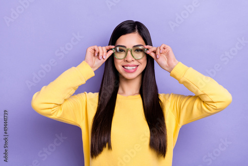 Photo of young pretty girl hands touch eyeglasses clever marketer isolated over purple color background