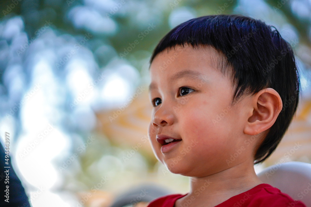 Cute little child thinking, close up, Selective focus, Blurred Background. Portrait of Cute kid thinking at the park. Cute little child thinking, close up, Selective focus, Blurred Background. Portrait of Cute kid thinking at the park.