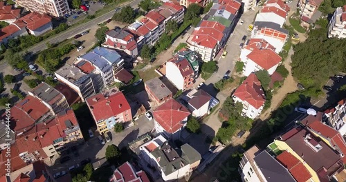 Drone aerial video of the tipical red Bulgarian roofs with solar panels, south of Bulgaria. Alternative energy concept. photo