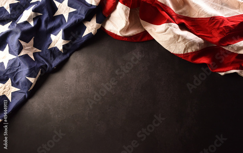 Happy memorial day concept made from American flag on dark stone background. photo