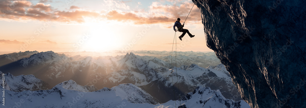 Adult adventurous man rappelling down a rocky cliff. Extreme adventure composite. 3d rendering mountain artwork. Aerial background landscape from British Columbia, Canada. Cloudy Sunset Sky - obrazy, fototapety, plakaty 