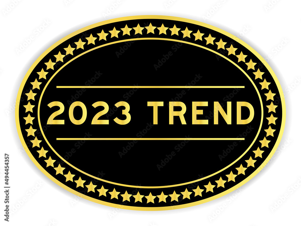 Black and gold color round label sticker with word 2023 trend on white background