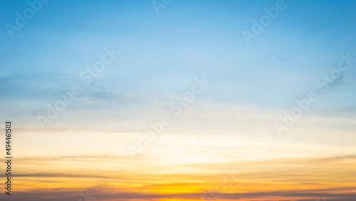 Fototapeta Naklejka Na Ścianę i Meble -  Beautiful Vivid sky painted by the sun leaving bright golden shades.Dense clouds in twilight sky in winter evening.Image of cloud sky on evening time.Evening Vivid sky with clouds.