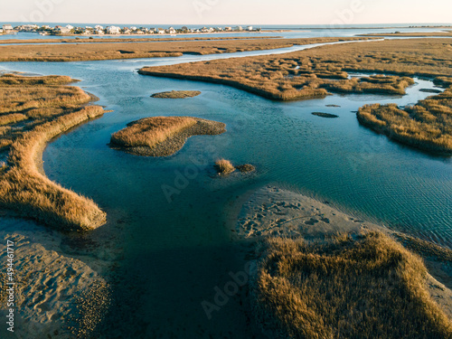 Aerial view of the flowing water in grasslands in bright sunlight, Murrells Inlet, SC, United States