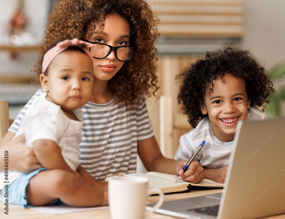 Young irritated African-American mother freelancer trying to work while working remotely with kids Young irritated African-American mother freelancer trying to work while working remotely with kids