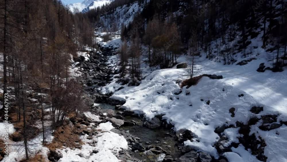 Beautiful mountain landscape. Aerial view snow covered river in the valley. Flowing water. Video 4K Beautiful mountain landscape. Aerial view snow covered river in the valley. Flowing water. Video 4K