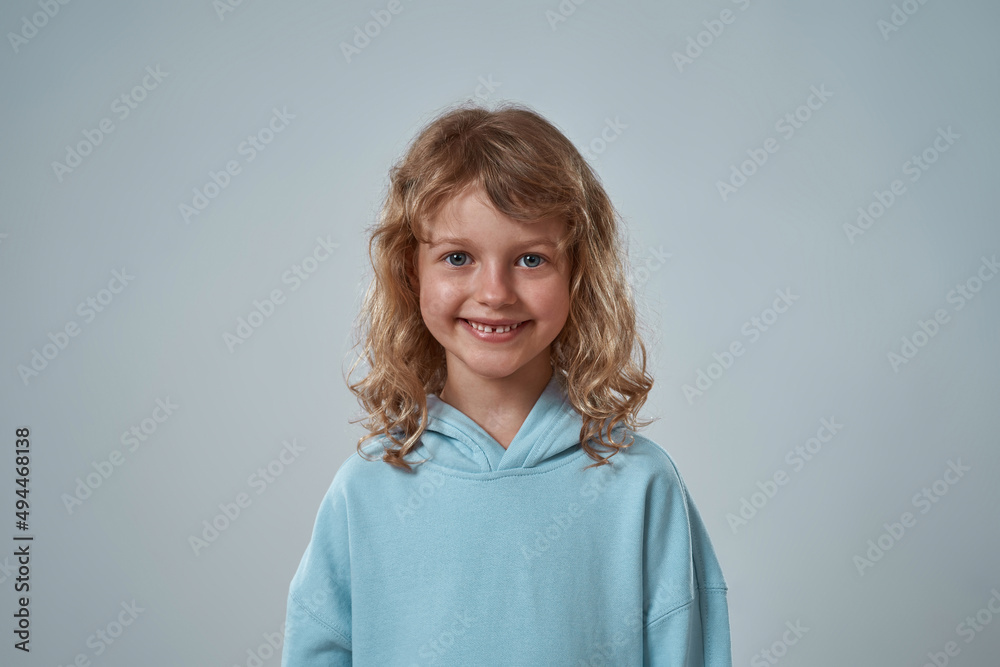 Portrait of smiling little girl looking at camera