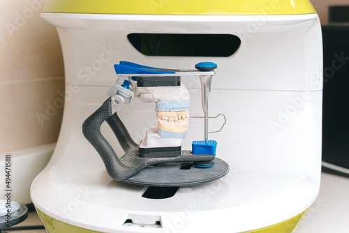 Horizontal photo of a 3d scanner for teeth or denture made of gypsum.