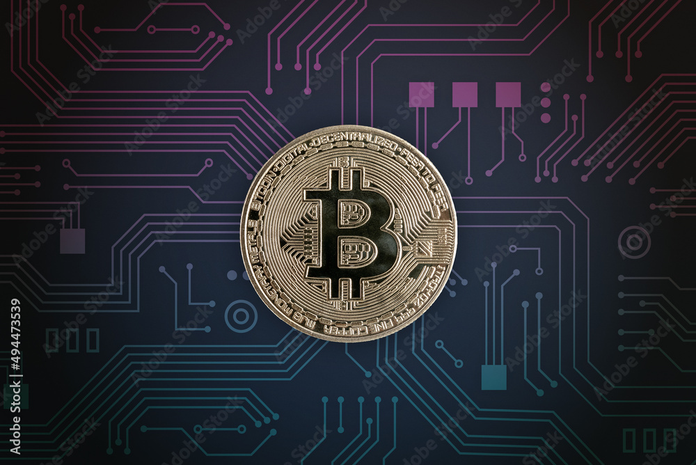 Bitcoin on electronic circuit board. Digital crypto currency concept Bitcoin on electronic circuit board. Digital crypto currency concept