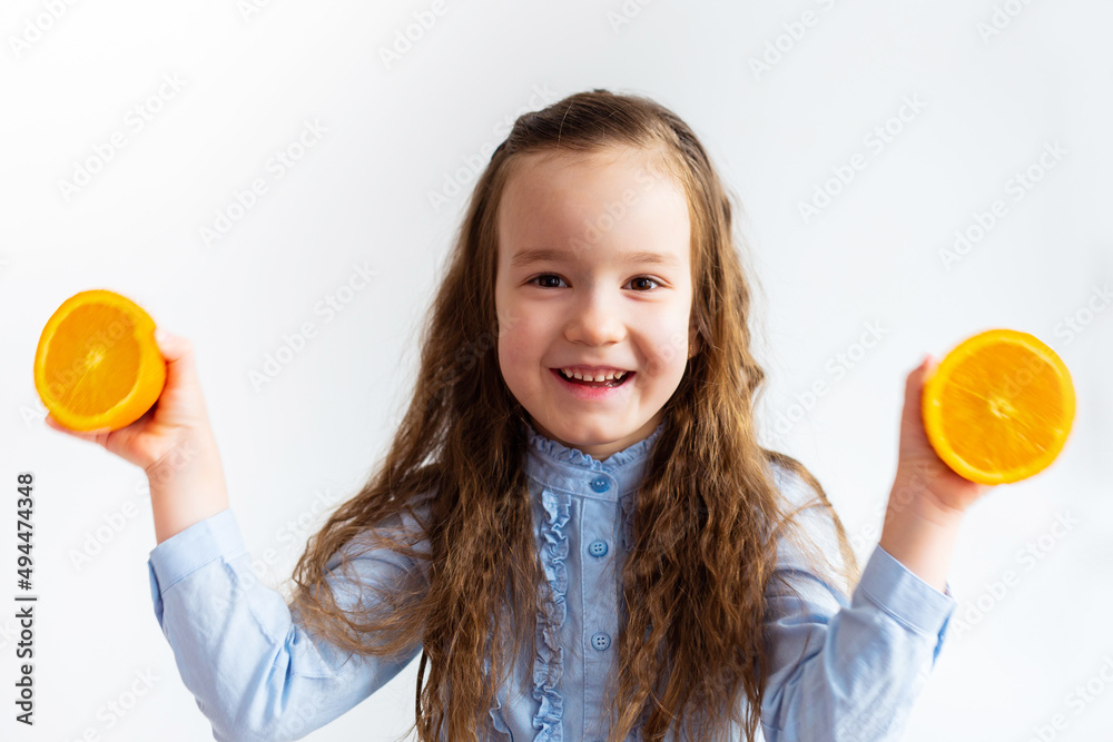 young cheerful girl with a beautiful smile holds lemon slices. On a plain background. Portrait of a beautiful brunette girl, holding a fresh slice of lemon, prefers natural organic face care products. young cheerful girl with a beautiful smile holds lemon slices. On a plain background. Portrait of a beautiful brunette girl, holding a fresh slice of lemon, prefers natural organic face care products.